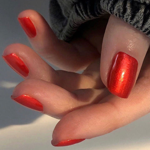 Shiny orange red nails